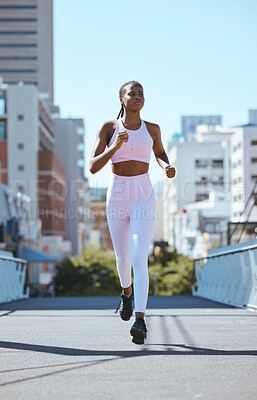 Buy stock photo Black woman, city running and cardio fitness training, workout and exercise in urban city outdoors. Focus, motivation and wellness of strong, healthy and african sports runner athlete sprint in town