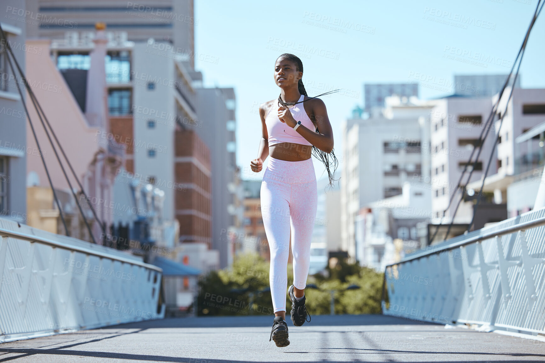 Buy stock photo Exercise workout of black woman running for health and fitness across city bridge. Training for better cardio, endurance and motivation for an active lifestyle in this urban scene. 