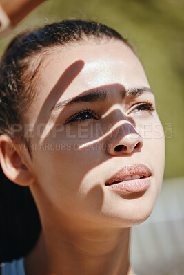 Buy stock photo Face, shadow and woman in sun for outdoor leisure and peaceful summer break for mental wellness. Beautiful young latino girl outside to relax and get fresh air covering eyes from sunlight outdoors