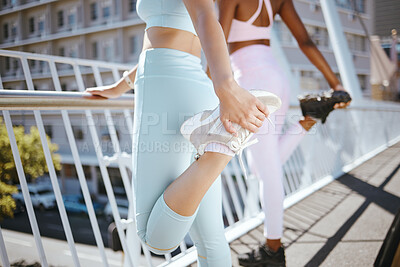 Buy stock photo Fitness shoes, stretching legs and women friends with motivation for exercise, running or outdoor workout. Diversity athlete people in sports clothes and sneakers or trainers doing warm up on bridge
