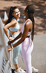 Fitness, running workout and friends training together in the city of New Zealand for body health. Portrait of African runner and black woman doing outdoor exercise for health and wellness in street