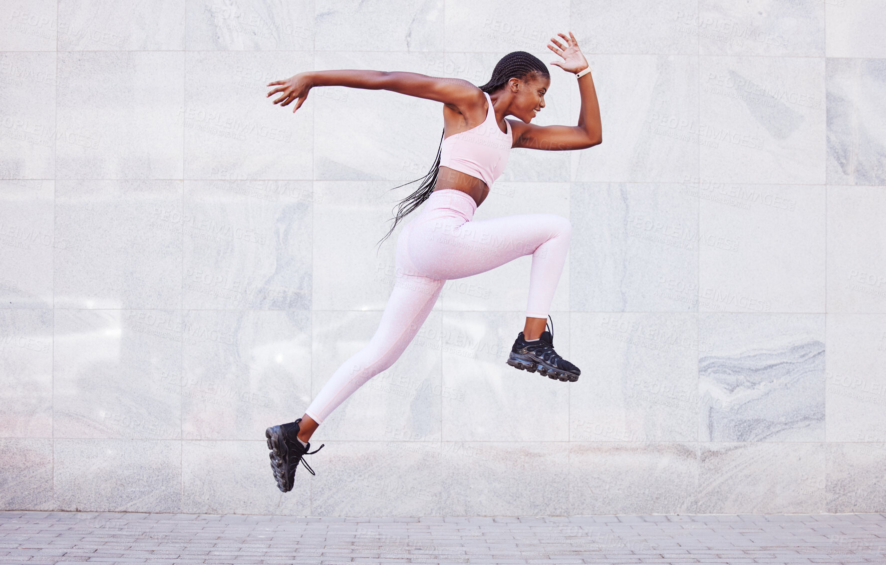 Buy stock photo Energy, sports and black woman jump running outdoor for fitness, wellness and outdoor training with wall mockup. Young, healthy african girl in athlete runner clothes for fashion mock up background