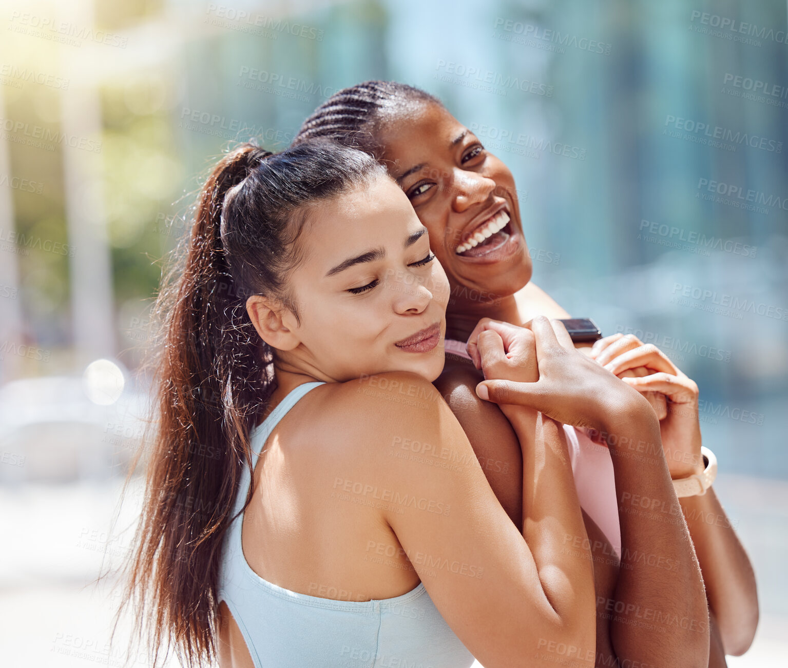 Buy stock photo Hug, fitness and friends training in the city with smile for outdoor workout together in summer. Portrait of black woman and runner hugging as motivation for exercise and energy for cardio in Canada