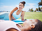 Yoga, women and friends communication in park, conversation or relax together. Zen, break and happy females lying on grass, nature or outdoors talking after pilates for health, fitness and wellness
 