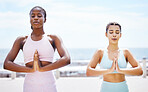 Yoga, zen and meditation with girl friends outdoor for training, workout and exercise on the beach. Fitness, sport and health with a female and friend exercising during summer for spiritual wellness