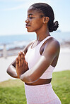 Nature yoga, meditation and black woman praying for spiritual wellness on the grass in the city of San Francisco. Calm, happy and young African girl doing zen exercise for mind health in a park