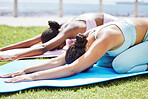 Yoga, workout and friends stretching and training outdoor for exercise, workout and fitness. Health, wellness and zen with women exercising and meditation for healthy body outside on grass in nature