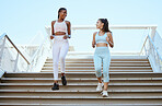 Fitness women, running steps and exercise for healthy lifestyle, wellness and marathon training in urban city outdoors. Happy athletes, runners and friends cardiovascular workout down stairs together