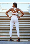 Fitness, motivation and stairs with black woman training for health, wellness and exercise. Sports, success and summer with back of young girl standing at steps for achievement, workout and running