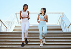 Fitness, health and exercise with personal trainer and woman workout on stairs, talking and bonding. Friends training and cardio workout by cheerful ladies enjoying healthy lifestyle and morning run