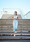 Fitness, smartwatch and health tracking with sports woman checking pulse and progress during exercise on building steps in a city. Training, time and cardio workout by Mexican girl monitor wellness