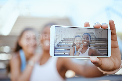 Buy stock photo Selfie, phone and fitness with girl friends taking a photograph during a workout, exercise or training. Sports, wellness and health with a black woman and friend posing for a mobile picture