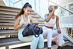 Fitness bag, water bottle and friends relax on steps with sports fashion for wellness motivation, outdoor exercise and collaboration. Healthy athlete runner couple taking break on staircase with gear