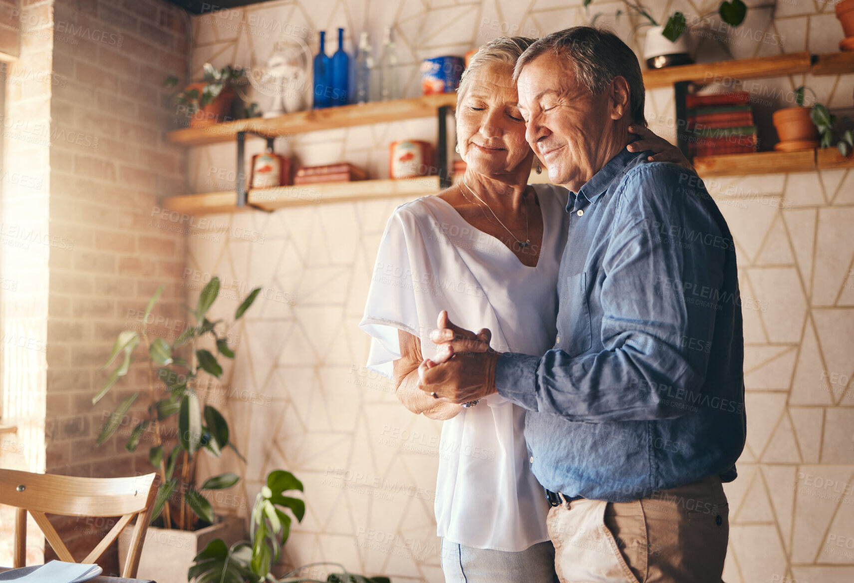 Buy stock photo Dance, old couple and love holding hands dancing to music at home in memory of a happy marriage, romance and anniversary. Senior woman enjoy quality time, bonding and romantic retirement with partner
