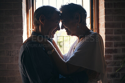 Buy stock photo Love, dance and elderly couple hug in living room window, romantic and bonding in their home together. Romance, retirement and sweet seniors sharing a romantic moment, dancing and embracing in house
