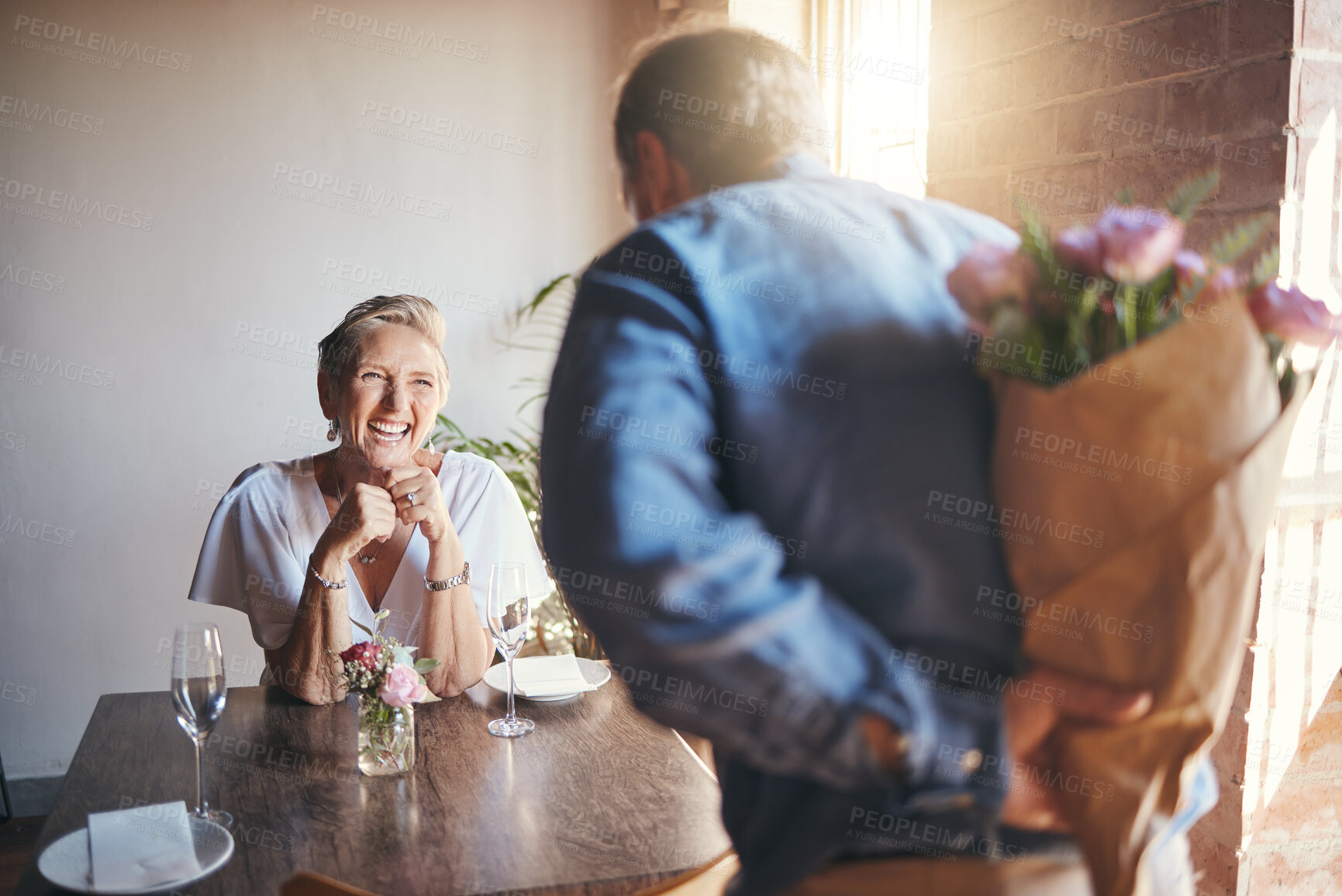 Buy stock photo Elderly, couple and flowers on a date for surprise, love and romance in their house. Senior woman, man and retirement together with bouquet to celebrate marriage, birthday or anniversary in the home