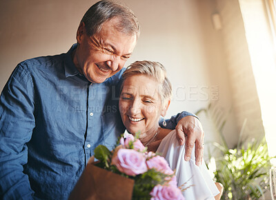 Buy stock photo Couple, romance and flowers with a senior man and woman in celebration of valentines day or their anniversary. Retirement, love and affection with an elderly male and female pensioner in their home