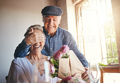 Buy stock photo Love, flowers and surprise gift with elderly couple in celebration of a birthday or anniversary, happy and romantic. Family, marriage and senior man and woman celebrating their relationship together