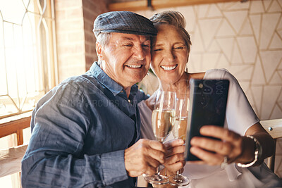 Buy stock photo Senior couple taking selfie with phone, champagne and love for marriage anniversary, celebration or birthday at house. Happy, married and smile man and woman post on social media with alcohol in home