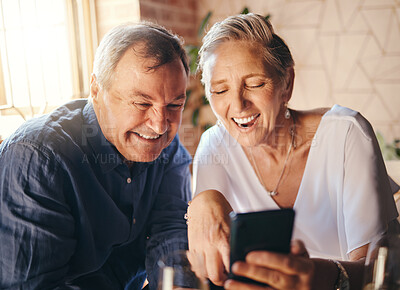 Buy stock photo Happy, love and senior couple on a phone scrolling on social media together in coffee shop. Happiness, smile and elderly man and woman reading a blog on website or browsing the internet on smartphone