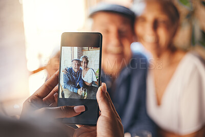 Buy stock photo Pov, phone and woman taking picture of old couple at restaurant. Love, smile and elderly, romantic and retired couple hug with person taking photo for happy memories, 5g mobile or social media post.
