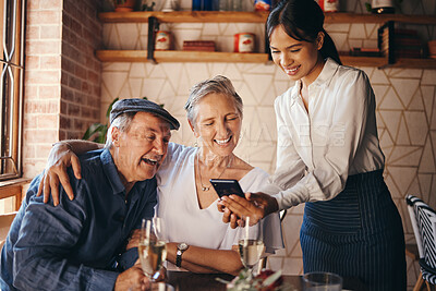 Buy stock photo Couple, restaurant and date with a senior man and woman paying their bill with a waitress on her phone. Payment, service and romance with an elderly male and female pensioner on their anniversary