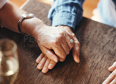 Buy stock photo Holding hands, date and couple with support at restaurant for celebration of love, marriage and anniversary. Man and woman with trust, care and gratitude at a cafe or coffee shop table for dinner