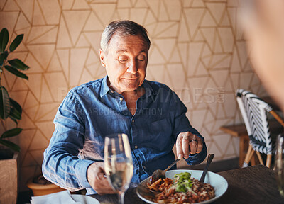 Buy stock photo Senior man eating healthy and nutrition food at restaurant happy, satisfied and at table. Alone, elderly male and customer enjoy a delicious, meal with salad and fine dining for dinner, lunch or diet