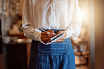 Food order, restaurant and hands of waiter writing notes on paper about lunch while working at a cafe. Flare of a waitress or barista with notebook for dinner service at fine dining coffee shop 