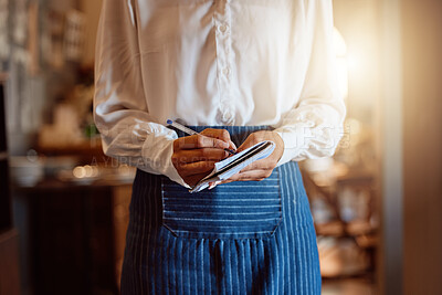 Buy stock photo Food order, restaurant and hands of waiter writing notes on paper about lunch while working at a cafe. Flare of a waitress or barista with notebook for dinner service at fine dining coffee shop 