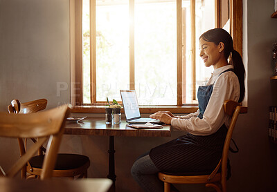 Buy stock photo Female, coffee shop owner and laptop restaurant worker on a work break on a laptop. Happy smile of waiter employee online at a cafe using technology on the internet reading a job email with happiness