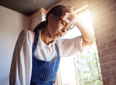 Buy stock photo Woman, tired and apron tired from working in cafe, home or cooking job. Girl, chef and cook with headache from cooking burnout or work for service in cafe, kitchen or coffee shop in London