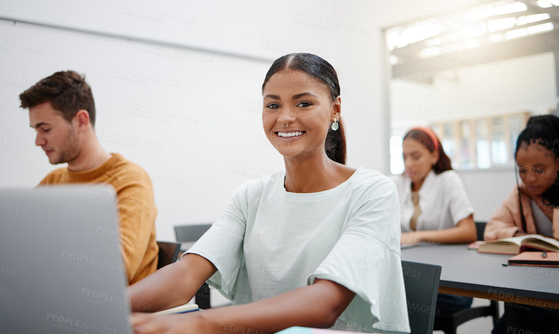 Buy stock photo College student portrait, lecture classroom and laptop typing notes, learning and education for school, campus and university. Happy woman studying computer tech at desk for exam, knowledge and test