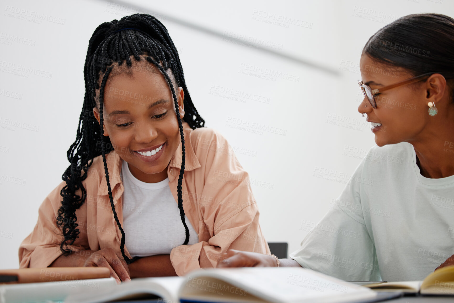 Buy stock photo Black woman, education and learning with books on table with girl, tutor or teacher. Friends, students and study together at desk with notebook for college, university or school while home in Phoenix
