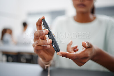 Buy stock photo Diabetes, finger and black woman with blood sugar test on to check levels of student while sitting at desk. Healthcare, health and female prick to use glucose meter for insulin and wellness