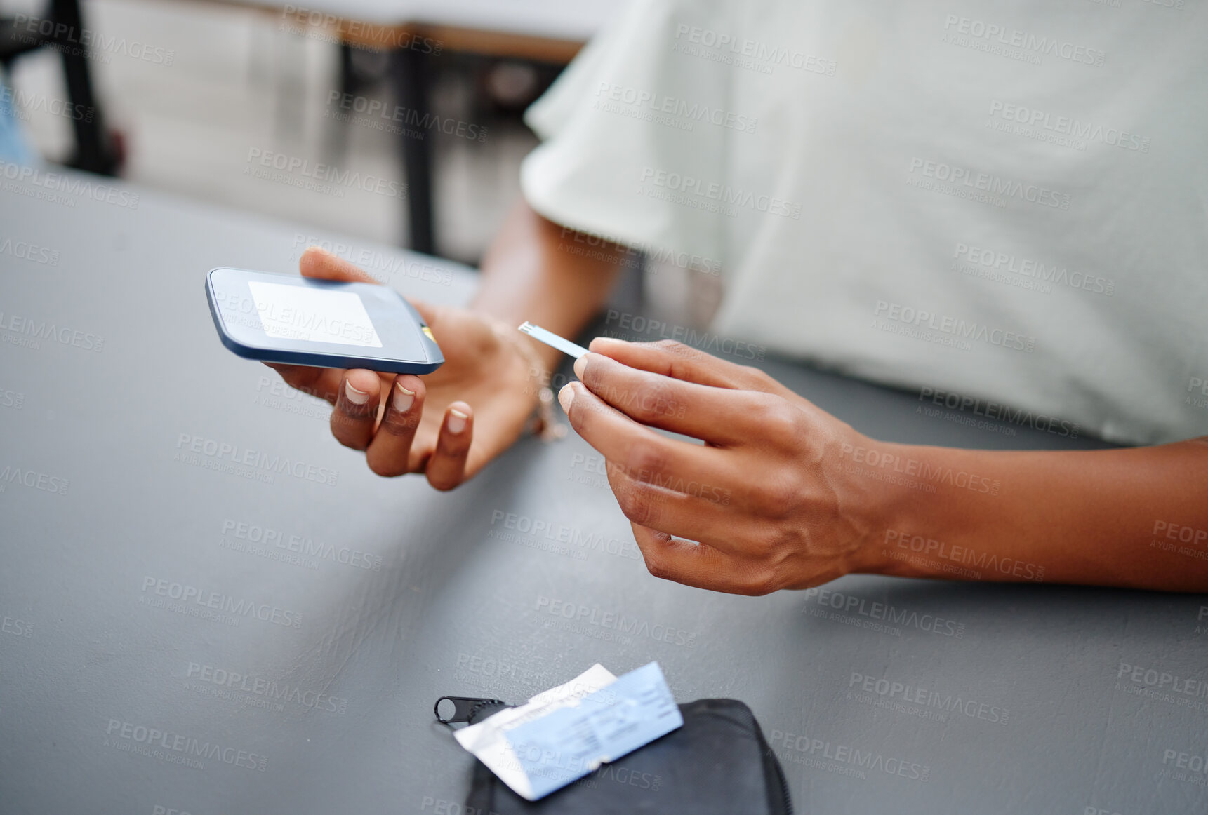 Buy stock photo Diabetes, hands and black woman with glucometer on desk checking blood sugar levels. Healthcare, health and student learning how to use glucose meter to test insulin levels for wellness or education
