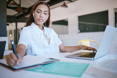 Buy stock photo Laptop, research or startup woman writing in notebook for planning, schedule or meeting agenda in office. Strategy, learning and study with headphones listening to music, radio or podcast for growth