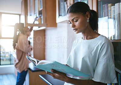 Buy stock photo Woman, student and reading a book in library for education, learning and knowledge indoors. Focused female doing research for school project at university in study with books for information