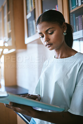 Buy stock photo Reading, books and black woman student in library or university workspace studying for language exam, education or information. College girl and print literature for research, scholarship or learning