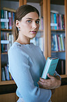 Education, books or university student in college library, classroom or school campus and scholarship goals. Portrait, girl or learning woman and textbook, graduate mindset or notebook study research