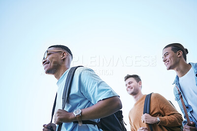 Buy stock photo Education, friends and students walking to university campus with backpack low angle. Scholarship, diversity and happy people ready for learning, studying or academic work in the morning in college

