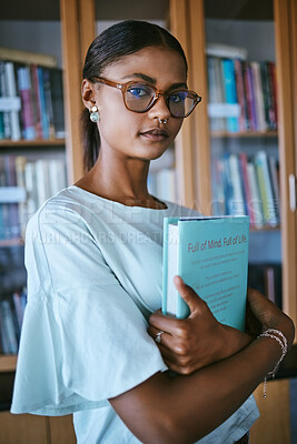 Buy stock photo Woman student with library print books from shelf for college or university education and learning knowledge. Young female or person with hardback English book in hands for studying or reading