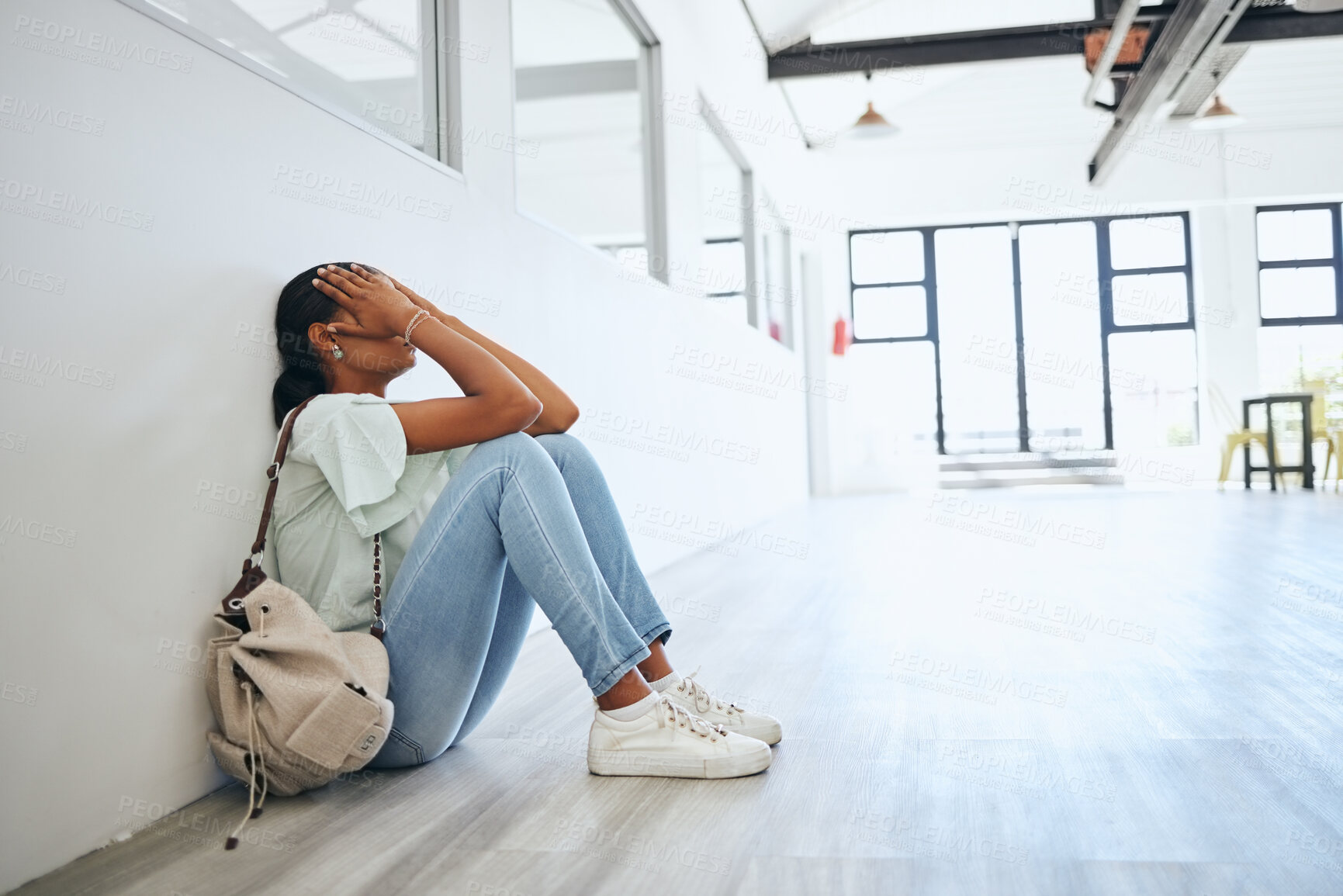 Buy stock photo Sad, depression and anxiety student woman on floor in university campus classroom with stress for education scholarship. Depressed, burnout and tired college girl crying for fail, mistake or debt
