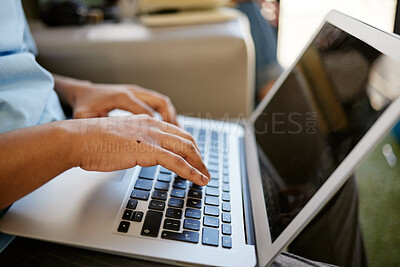 Buy stock photo Hands typing on laptop, sitting on sofa at university and studying online. Student on social media, research school project or writing email on couch. Internet, computer and man with hand on keyboard