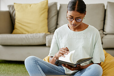 Buy stock photo College student woman writing notebook, reading research and learning for education, knowledge or project on campus floor in Brazil. University youth, focus studying and journal notes in school books