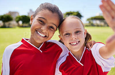 Buy stock photo Selfie, soccer and sport with a girl team taking a photograph on a football field before a game with a smile. Children, sports and exercise with female child friends posing for a picture outside