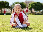 Soccer player, fitness and girl on field, soccer training and sports activity outdoor. Sport, health and exercise with child relax on grass, prepare for football game, checking shoes, happy and smile
