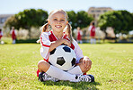 Soccer ball, sports girl and field sitting, training for youth competition match playing at stadium grass. Portrait, young athlete or player enjoy youth football world cup championship game at club