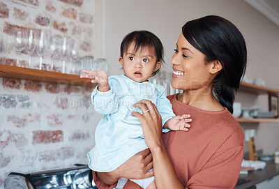 Buy stock photo Love, happy mom and baby with down syndrome in kitchen in family home. Care, growth and support for child development for woman from India. Indian mother in house with cute toddler with disability.