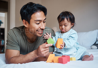 Buy stock photo Baby, down syndrome and learning on a bed with child and father playing with educational blocks in a bedroom. Family, disability and kids bonding with asian parent, relax with creative activity